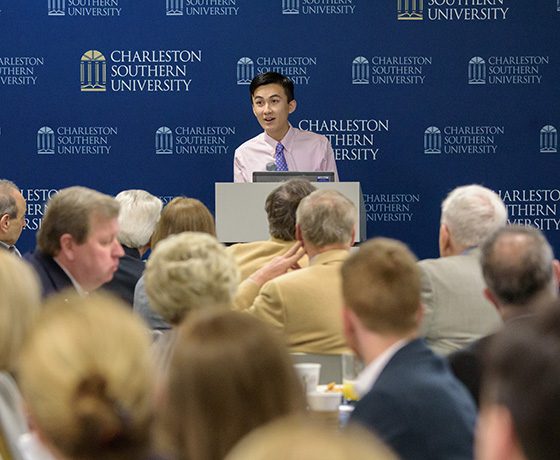 S students speaks at a podium to the CSU Board of Visitors.