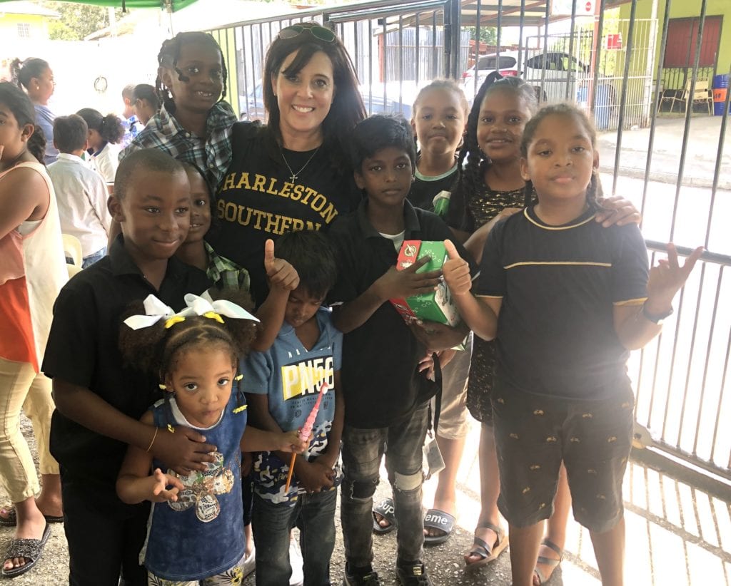 Laurie Diel represents Charleston Southern University at a trip for Operation Christmas Child